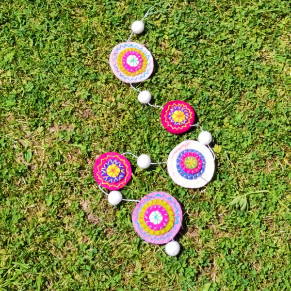 Embroidered discs string