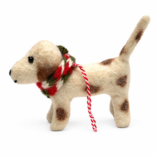 Puppy wearing woolly scarf decoration Brown and white puppy in woolly scarf